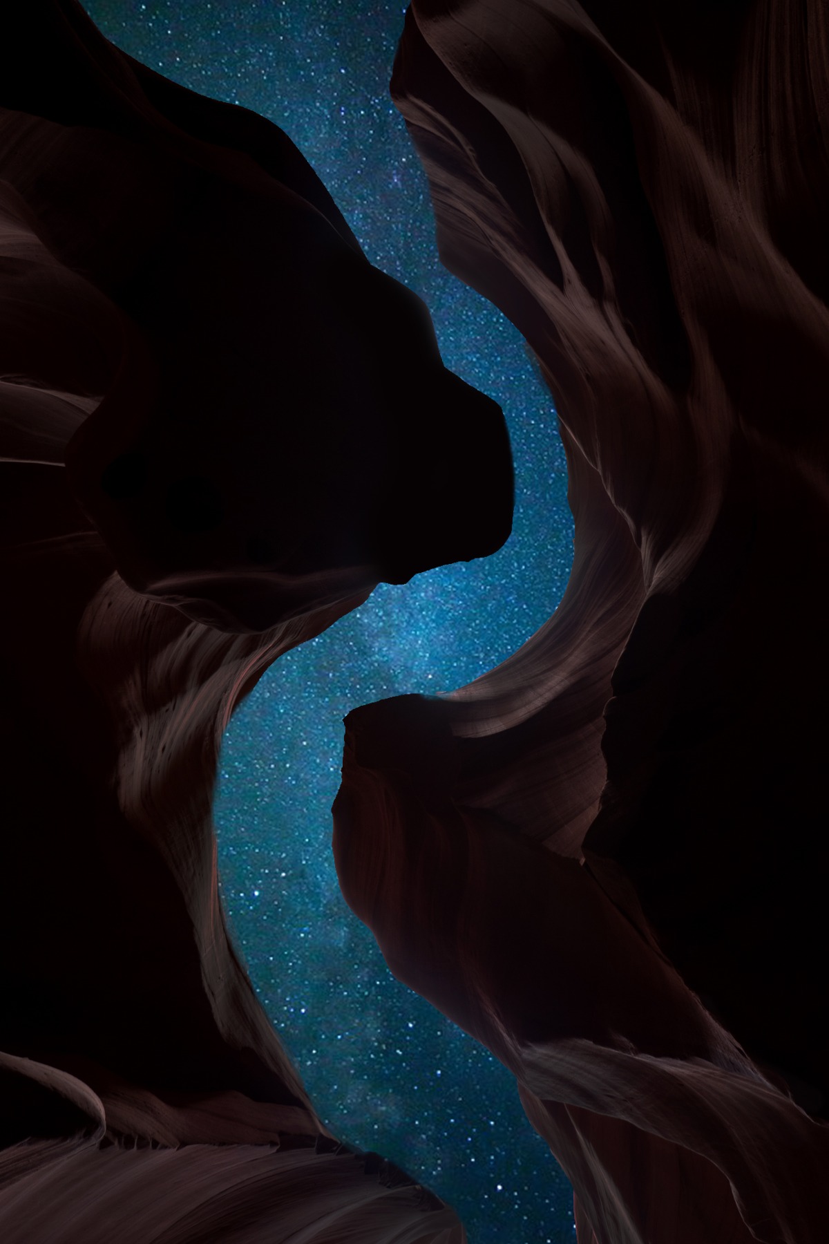 View from the floor of a narrow canyon: between water-carved red sandstone walls, a band of deep blue starry sky cuts across the image.
